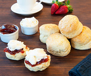 House baked scone with jam and cream thumbnail